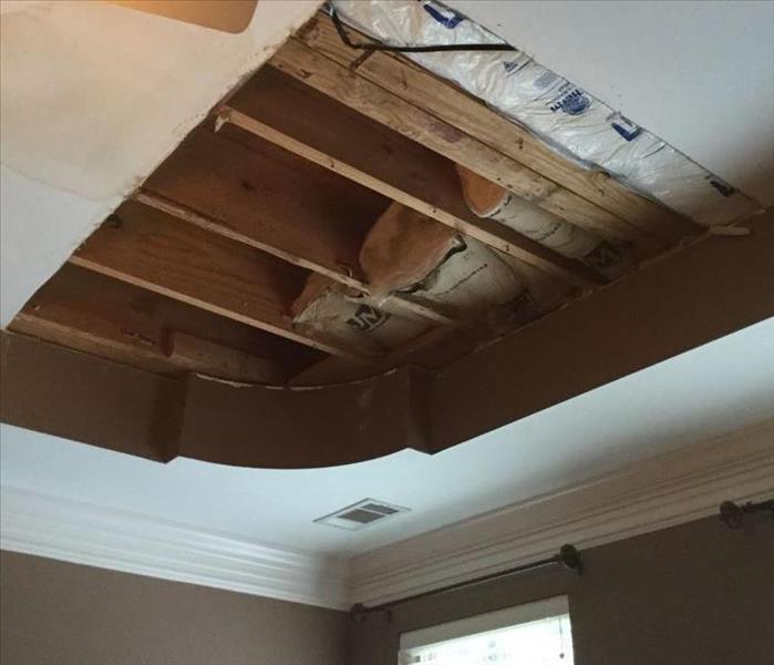 water damaged ceiling with insulation and drywall removed