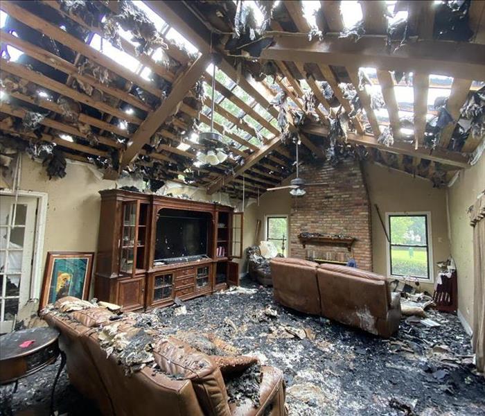 Living room with destroyed ceiling  