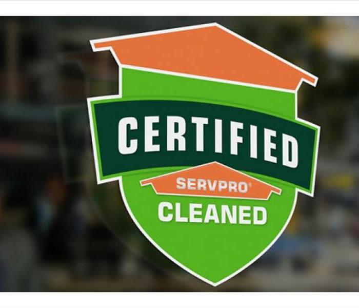 green and orange sticker that reads Certified: SERVPRO Cleaned